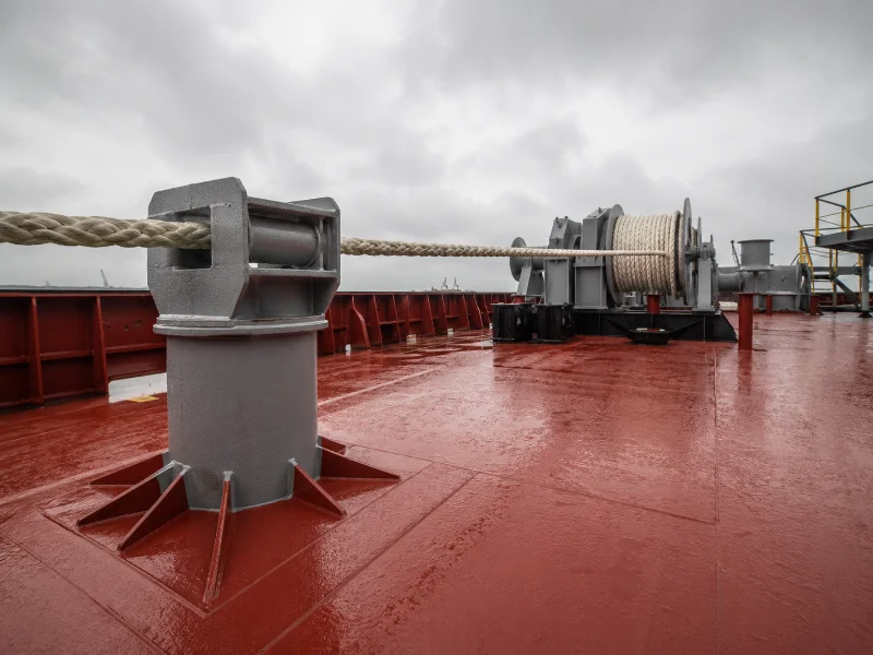 Pedestal roller fairlead raising the lead point to align a mooring line with the winch drum.